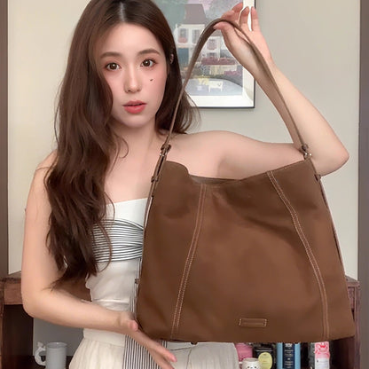 Sac messager en cuir souple et daim de haute qualité, grande capacité et au design épuré