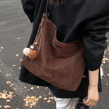 Sac messager en cuir souple et daim de haute qualité, grande capacité et au design épuré